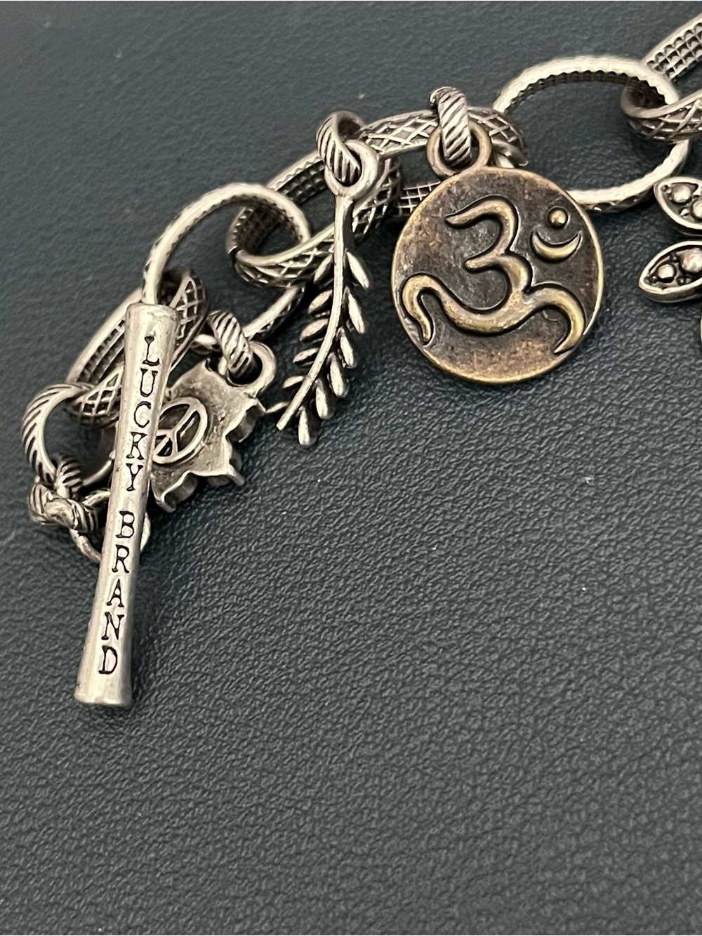 Lucky Brand Two-Tone Charm Bracelet with Om Disc and Leaf Charms